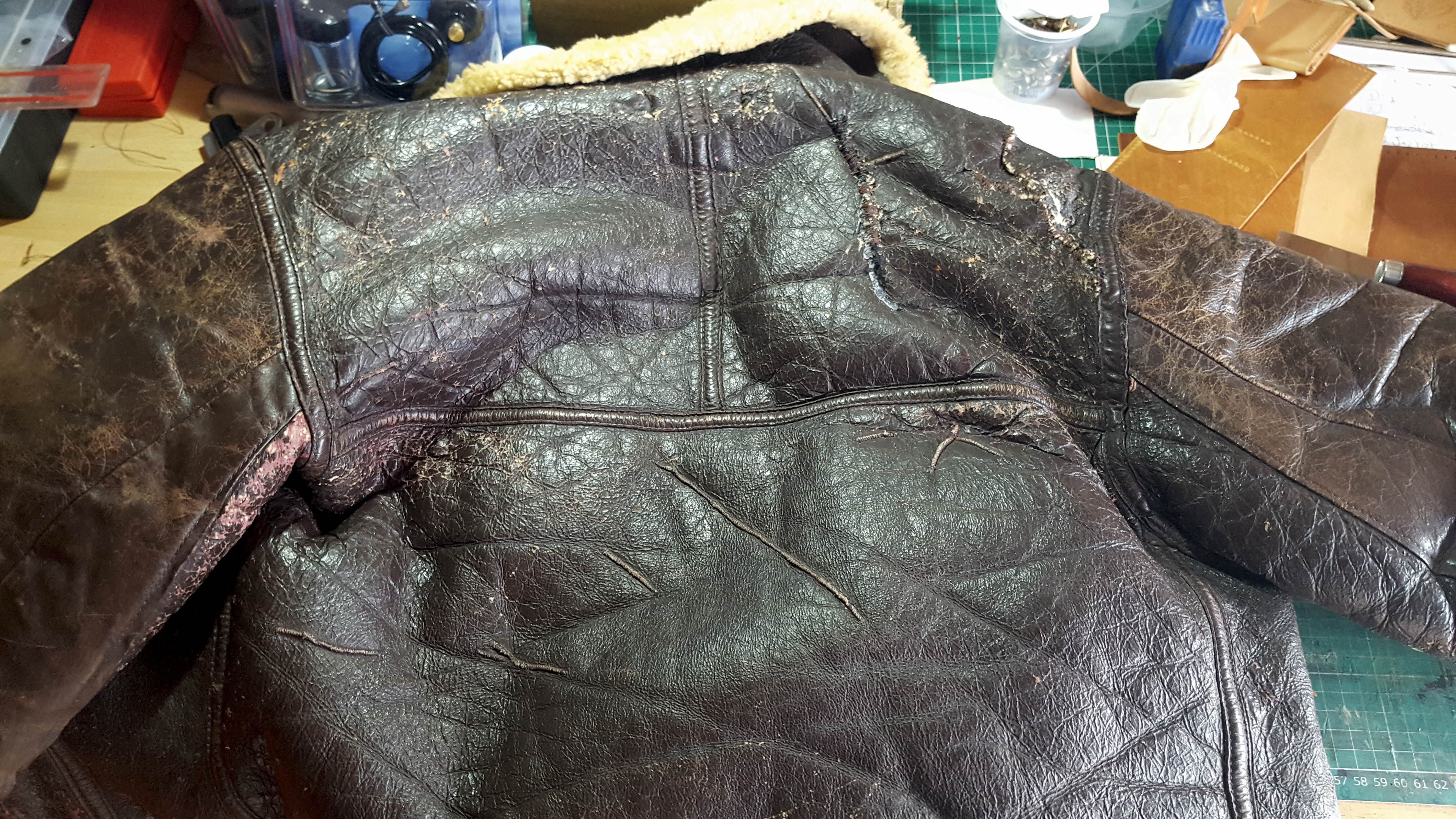 Leather WW2 bomber jacket in need of leather repair and restoration
