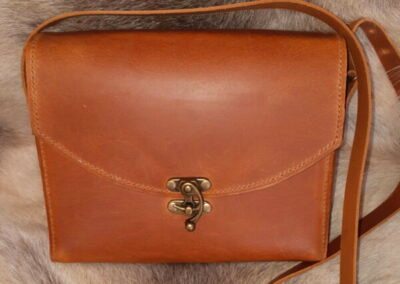 Tan leather messenger bag by primetronx.top 