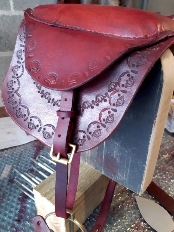 Red leather rocking horse saddle and tack